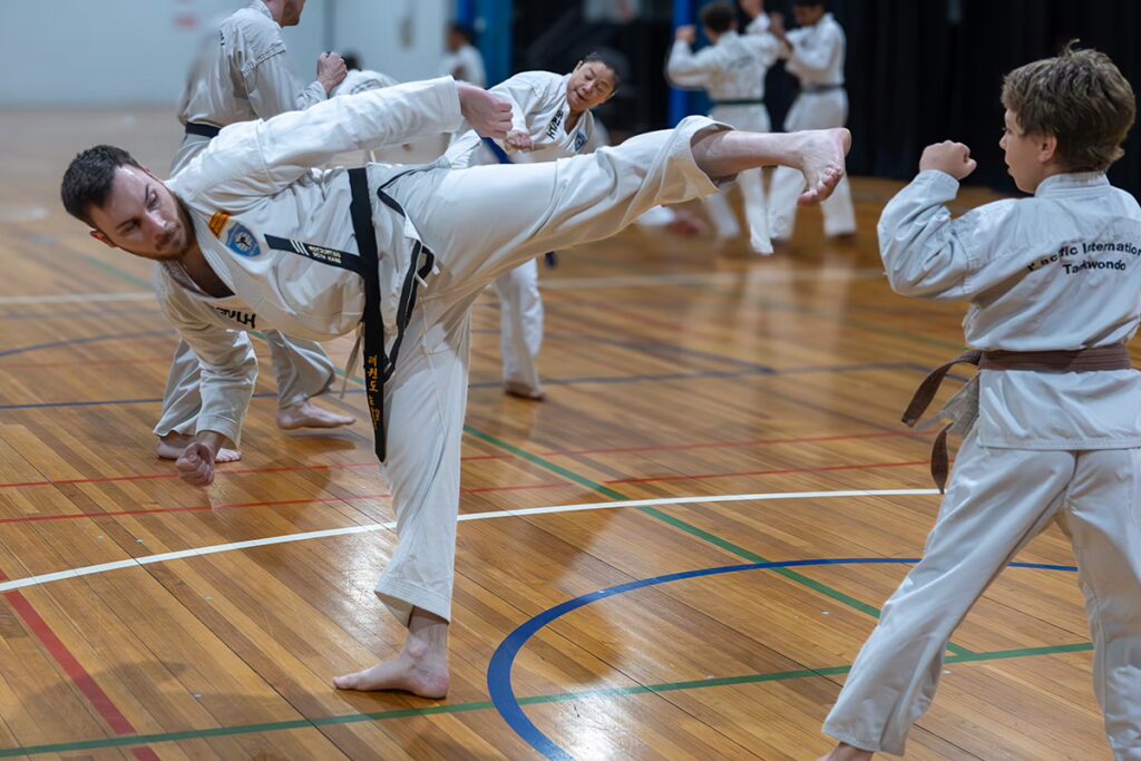 ALBANY CREEK Instructor Sean Hyde with young boy sparring
