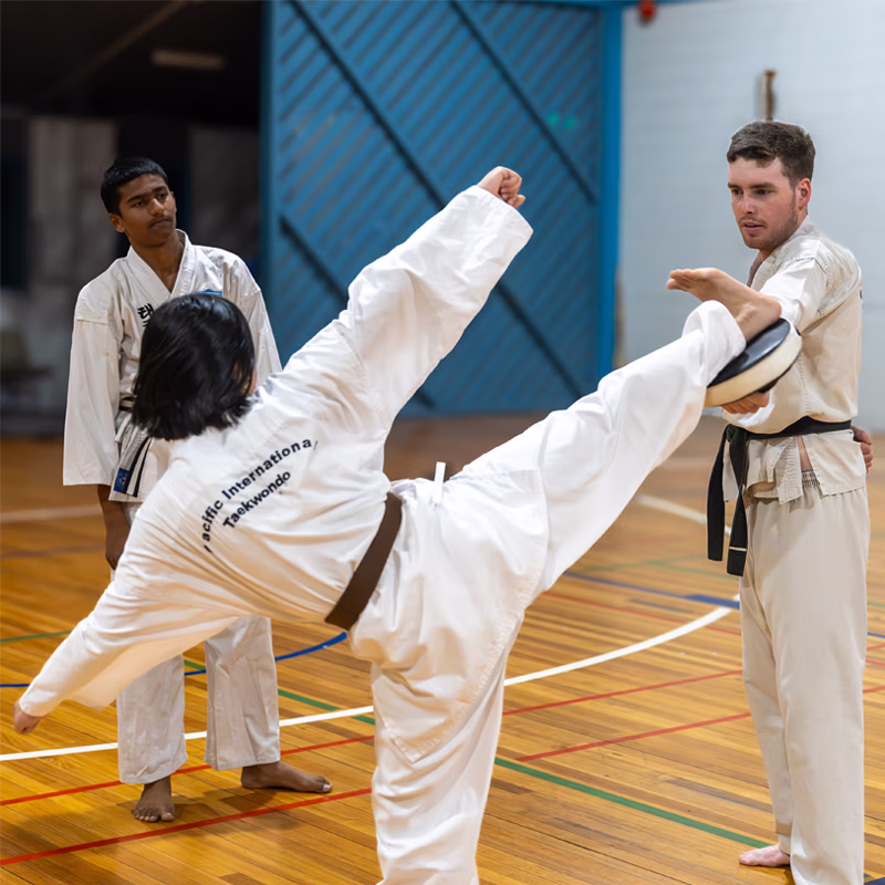 ALBANY CREEK teen girl horizontal kick at pad