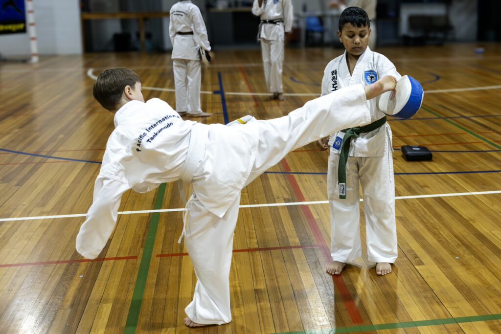 ALBANY CREEK young boy high kicks in pad-1